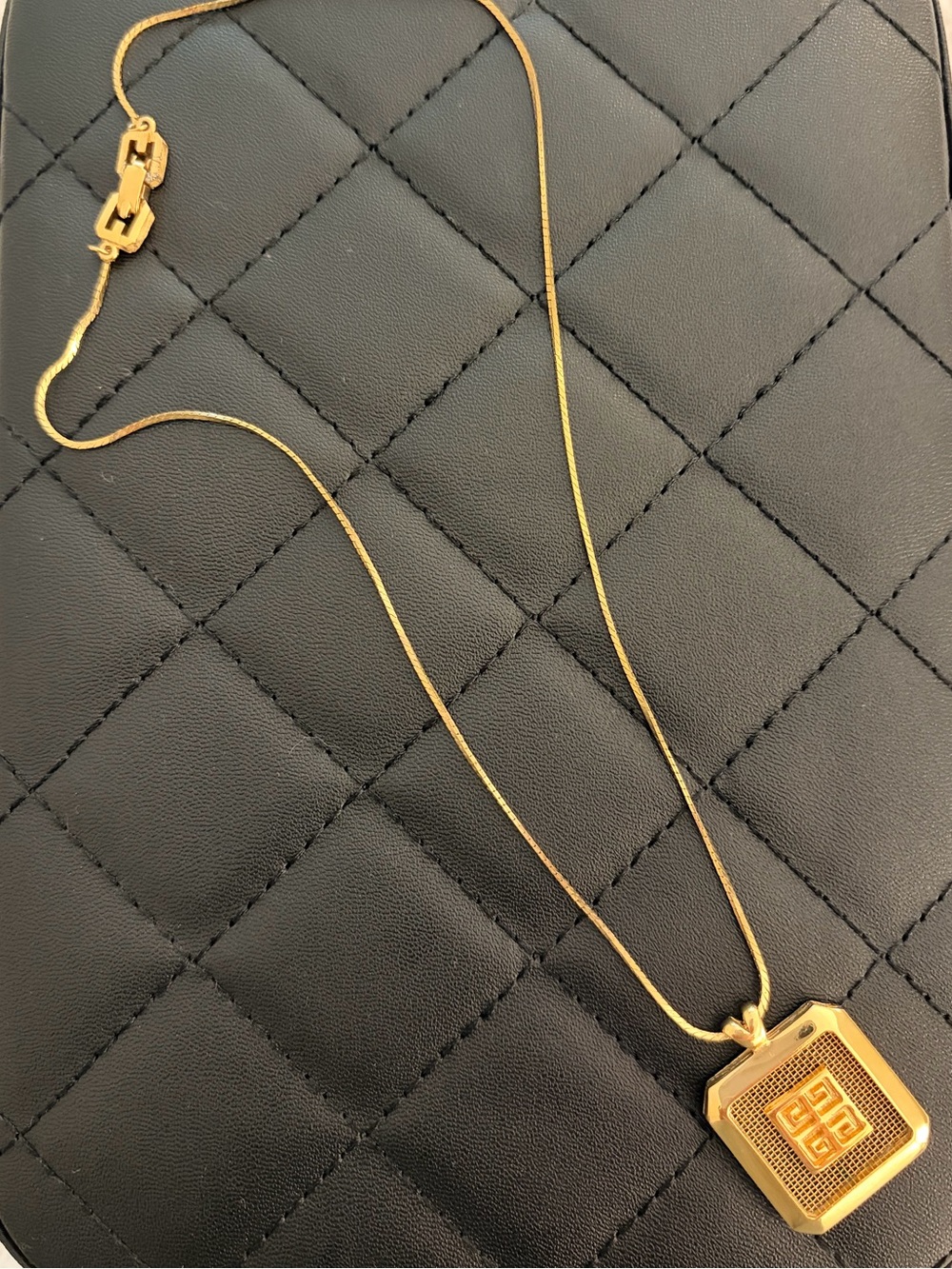 Necklace on black quilted case